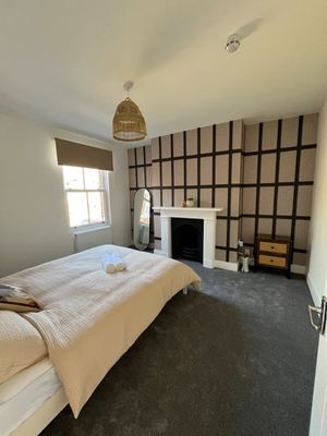 Bedroom with original fireplace